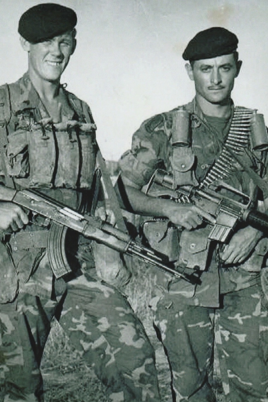 Two green berets pose in Vietnam. 